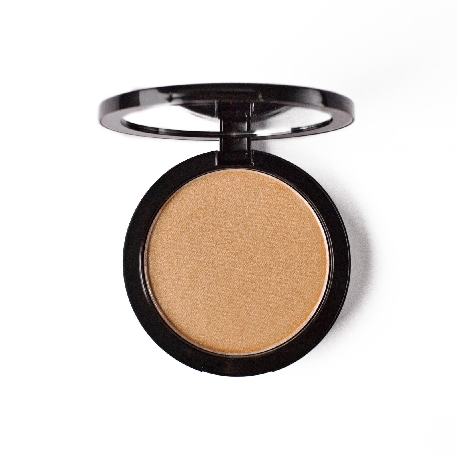 The Radiant Glow Luminizing Powder by Berla Beauty is displayed in a compact case with the lid open, showcasing its golden-toned luminizing powder. The round-shaped compact features a black outer rim and has a mirror inside the lid. This vegan formula offers a smooth, pressed texture for a radiant finish.